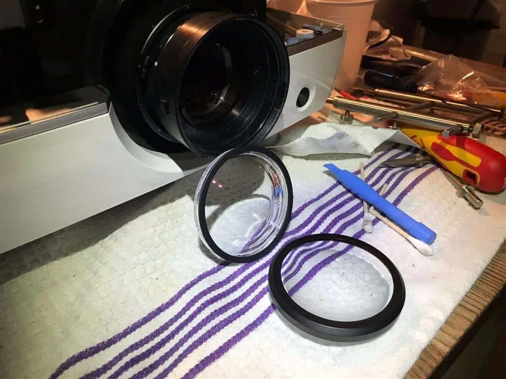 How to Clean a Projector Inside the lens